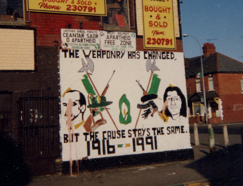 James Connolly and Bobby Sands alongside a rifle and Armalite, respectively; “The weaponry has changed, but the cause stays the same. 1916 - 1991.” (Eric Arnum)