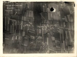 A photograph taken from a reconnaissance aircraft during World War I. The availability of a top-down look on enemy positions was indispensably valuable to artillery crews.