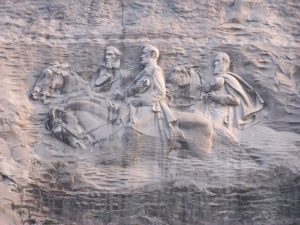 The carving in Stone Mountain features Stonewall Jackson, Jefferson Davis, and Robert E. Lee